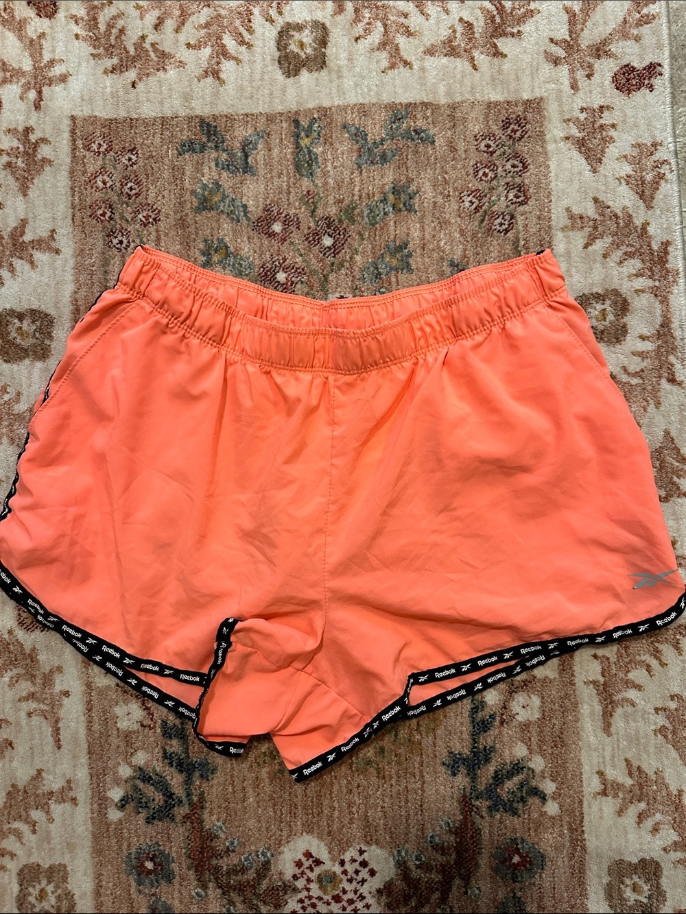 Reebok Women's Coral-Orange Athletic Shorts with Black Trim - Picture 1 of 6